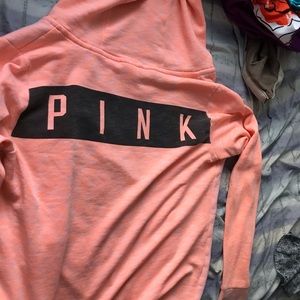 a pink zip up sweater